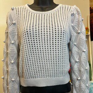 This One Grey Day sweater in size Small features a gray open stitch knit front a